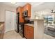 Well-maintained kitchen with stainless steel appliances and granite countertops adjoins the living area at 455 Alt 19 S # 65, Palm Harbor, FL 34683