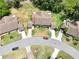 An aerial shot featuring a home with mature trees in a desirable neighborhood at 503 Finsbury Cir # A, Sun City Center, FL 33573