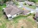 Aerial view of the property showcasing the lush landscaping and attached carport at 503 Finsbury Cir # A, Sun City Center, FL 33573