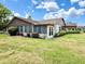 Spacious backyard with an enclosed lanai, perfect for outdoor relaxation and entertaining at 503 Finsbury Cir # A, Sun City Center, FL 33573