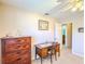 Bedroom with a ceiling fan, closet, desk, and futon at 503 Finsbury Cir # A, Sun City Center, FL 33573