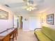 Bedroom with a ceiling fan, closet, desk, and futon at 503 Finsbury Cir # A, Sun City Center, FL 33573