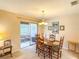 Bright dining room with sliding door access to outdoor patio at 503 Finsbury Cir # A, Sun City Center, FL 33573