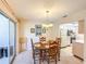 Cozy dining room adjacent to the kitchen with ample natural light at 503 Finsbury Cir # A, Sun City Center, FL 33573