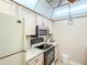 Bright kitchen features white cabinets and modern appliances at 503 Finsbury Cir # A, Sun City Center, FL 33573