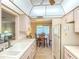 Well-lit kitchen offering views into the dining and living areas at 503 Finsbury Cir # A, Sun City Center, FL 33573