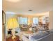 Bright living room with floral pattern furniture at 503 Finsbury Cir # A, Sun City Center, FL 33573