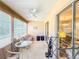 Inviting sunroom with neutral colors, a ceiling fan, and ample natural light at 503 Finsbury Cir # A, Sun City Center, FL 33573
