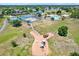 Aerial view showcasing community amenities, including a playground, tennis courts, and recreational area at 5137 Springwood Dr, Tampa, FL 33624