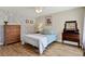 Comfortable bedroom with floral wallpaper, hardwood floors, and ample natural light at 5137 Springwood Dr, Tampa, FL 33624