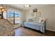 Charming bedroom featuring a daybed, floral artwork, a window and a vanity desk with chair at 5137 Springwood Dr, Tampa, FL 33624