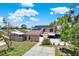 Charming two-story home featuring solar panels, a fenced yard, and curb appeal at 5137 Springwood Dr, Tampa, FL 33624
