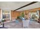 Cozy covered patio with ample seating, perfect for outdoor relaxation and entertaining at 5137 Springwood Dr, Tampa, FL 33624