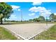 Beach volleyball court surrounded by green space under a bright sky at 5137 Springwood Dr, Tampa, FL 33624