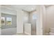 Bright bathroom and bedroom combination with a glass-door shower and neutral color palette at 5194 Everlong Dr, Apollo Beach, FL 33572