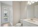 Clean bathroom featuring a shower, sink, and toilet with hardwood floors at 5194 Everlong Dr, Apollo Beach, FL 33572