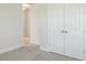 Bedroom with neutral carpet and closet with double doors at 5194 Everlong Dr, Apollo Beach, FL 33572