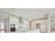 Bright and airy kitchen featuring stainless steel appliances, subway tile backsplash, and a spacious island at 5194 Everlong Dr, Apollo Beach, FL 33572