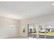 Living room featuring sliding glass doors offering a seamless transition to the outdoors and backyard views at 5194 Everlong Dr, Apollo Beach, FL 33572