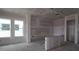 Unfinished kitchen with window and door frames ready for appliances and finishes at 5287 Everlong Dr, Apollo Beach, FL 33572