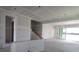 Unfinished living room with stairs, door frames and large sliding doors at 5287 Everlong Dr, Apollo Beach, FL 33572