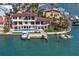Waterfront home with a pool, boat lift, and private dock offers stunning coastal living at 5939 Bayview S Cir, Gulfport, FL 33707