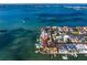 Waterfront property with multiple houses, docks, boat lifts, and boats at 5939 Bayview S Cir, Gulfport, FL 33707