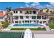 Beautiful backyard boasting a private boat dock, a sparkling pool, and multiple balconies to enjoy water views at 5939 Bayview S Cir, Gulfport, FL 33707