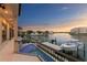 Balcony view overlooking the water, including a boat lift and community docks at 5939 Bayview S Cir, Gulfport, FL 33707