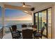 Covered balcony with water view and a table with seating for six at 5939 Bayview S Cir, Gulfport, FL 33707