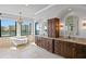 Luxurious bathroom with a soaking tub, dual vanities, and water views at 5939 Bayview S Cir, Gulfport, FL 33707
