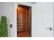 Interior view of wooden elevator cab with lighting and hardwood flooring at 5939 Bayview S Cir, Gulfport, FL 33707