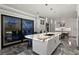 Gorgeous kitchen with marble countertops, custom cabinets, a large island, and sliding glass doors at 5939 Bayview S Cir, Gulfport, FL 33707