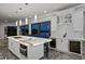 Stunning kitchen with a large marble island and bar seating, plus a wine fridge and built in cabinets at 5939 Bayview S Cir, Gulfport, FL 33707