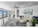 Bright and open living room featuring tile floors, modern decor, and a view to the kitchen at 5939 Bayview S Cir, Gulfport, FL 33707
