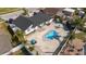 Aerial view of a backyard with a kidney-shaped pool and a spacious patio with lounge seating at 6428 Moss Way, Tampa, FL 33625