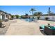 Spacious backyard featuring a pool, lounging area, manicured landscaping, and privacy fencing at 6428 Moss Way, Tampa, FL 33625