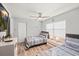 Charming bedroom with twin beds, coastal accents, and ample natural light from the window at 6428 Moss Way, Tampa, FL 33625