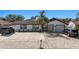 Charming home featuring a modern exterior, well-manicured landscaping, and a spacious driveway at 6428 Moss Way, Tampa, FL 33625