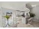 Open-concept kitchen and dining area with sliding glass doors to the backyard pool and patio area at 6428 Moss Way, Tampa, FL 33625