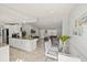 View of the open-concept living space featuring kitchen, dining area, and living room at 6428 Moss Way, Tampa, FL 33625