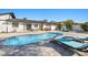 Inviting backyard pool area with stylish lounge chairs and a water feature for relaxation at 6428 Moss Way, Tampa, FL 33625