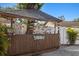 Outdoor tiki bar featuring a bamboo facade, decorative signs, and a covered roof at 6428 Moss Way, Tampa, FL 33625