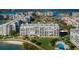Breathtaking aerial view showcasing the entire property and waterfront location, offering a glimpse of the community amenities at 7882 Sailboat Key S Blvd # 401, South Pasadena, FL 33707