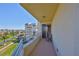 Private balcony with seating offering stunning views of the marina and coastal scenery at 7882 Sailboat Key S Blvd # 401, South Pasadena, FL 33707