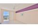 Bedroom with exterior views with sliding glass doors to covered outdoor balcony at 7882 Sailboat Key S Blvd # 401, South Pasadena, FL 33707