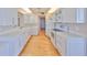 Bright kitchen featuring white cabinets, modern appliances, and sleek countertops at 7882 Sailboat Key S Blvd # 401, South Pasadena, FL 33707