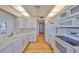 Bright kitchen featuring white cabinets, modern appliances, and sleek countertops at 7882 Sailboat Key S Blvd # 401, South Pasadena, FL 33707