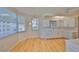 Bright kitchen with white cabinets and a cozy breakfast nook featuring large windows at 7882 Sailboat Key S Blvd # 401, South Pasadena, FL 33707