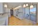 Bright open kitchen with stainless steel appliances, modern cabinetry, and a balcony entrance at 7882 Sailboat Key S Blvd # 401, South Pasadena, FL 33707